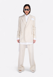 Angled front view of model wearing EMIRATES LIMITED Cotton Notch Lapel Blazer, East Vibe